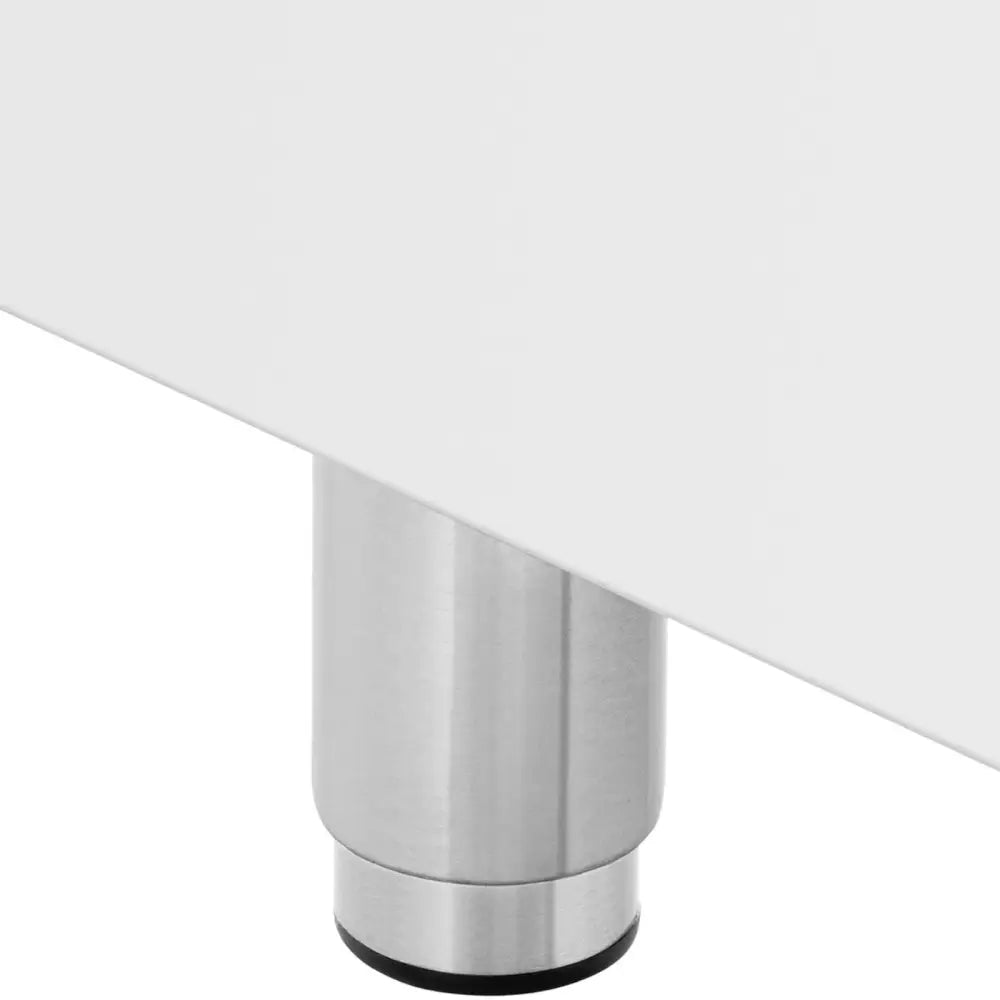 Sylinderformet ben i børstet metall med sort fot, montert på hvit base til elektrisk komfyr.