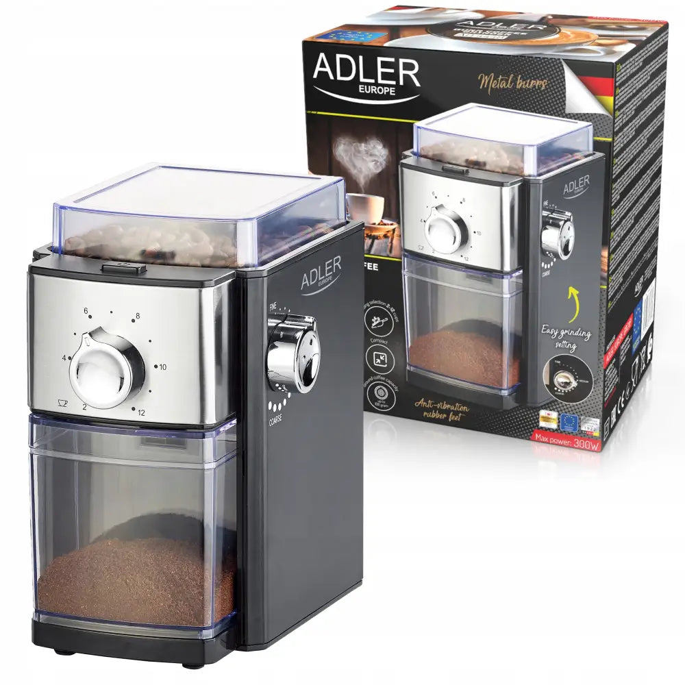 Elektrisk automatisk kaffekvern i sort og sølv med synlig bønnebeholder og emballasje i bakgrunnen.