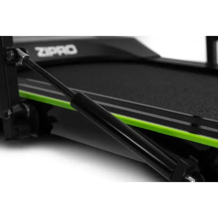 Tredemølle Zipro Lite, nærbilde som viser grønn kant, dempefunksjon og synlig hydraulisk stang under løpeflaten.
