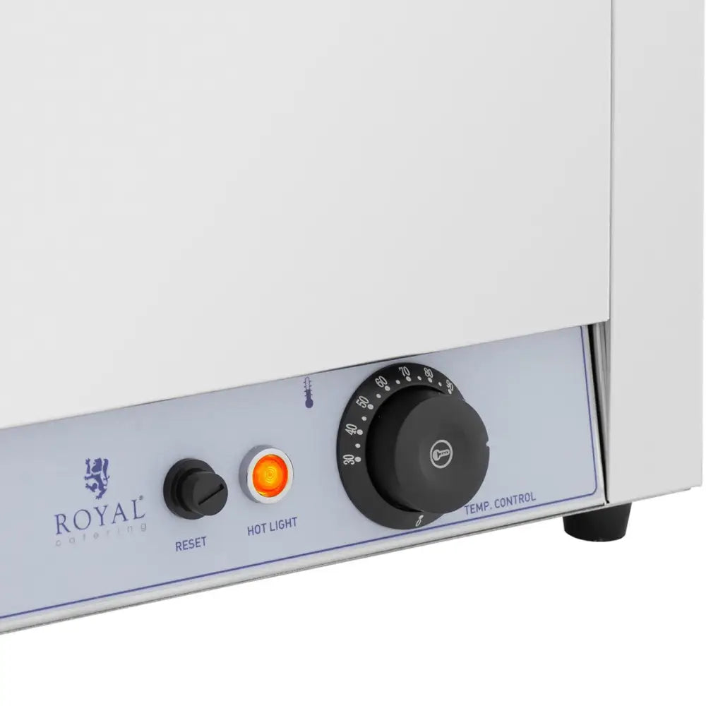 Elektrisk fonduekjele kontrollpanel med sort temperaturbryter, reset-knapp og oransje indikatorlampe.