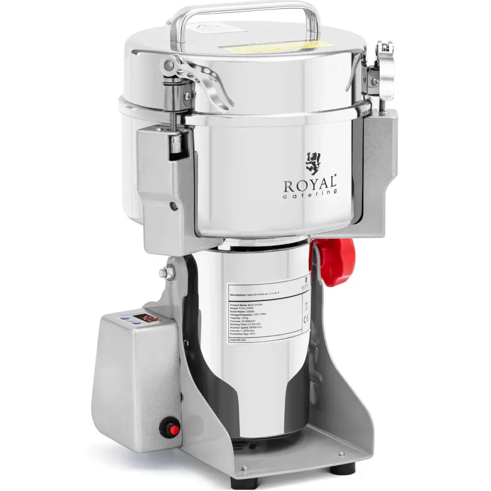 Elektrisk krydderurter og nøtter kvern i rustfritt stål, skrå forfra med håndtak og rød sperreknapp synlig.