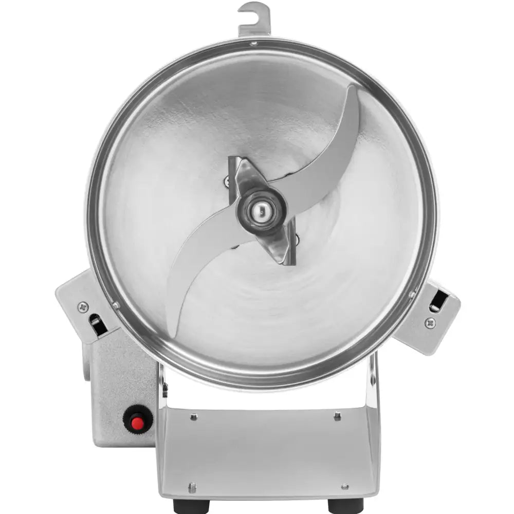 Elektrisk krydderurter og nøtter kvern, toppvinkel som viser doble knivblader og rød knapp på basen.