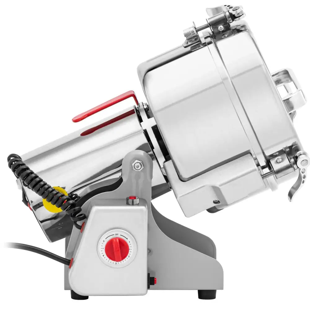 Elektrisk krydder- og kaffekvern i stål, sidevisning med rød justeringsknapp og synlig lokkmekanisme.