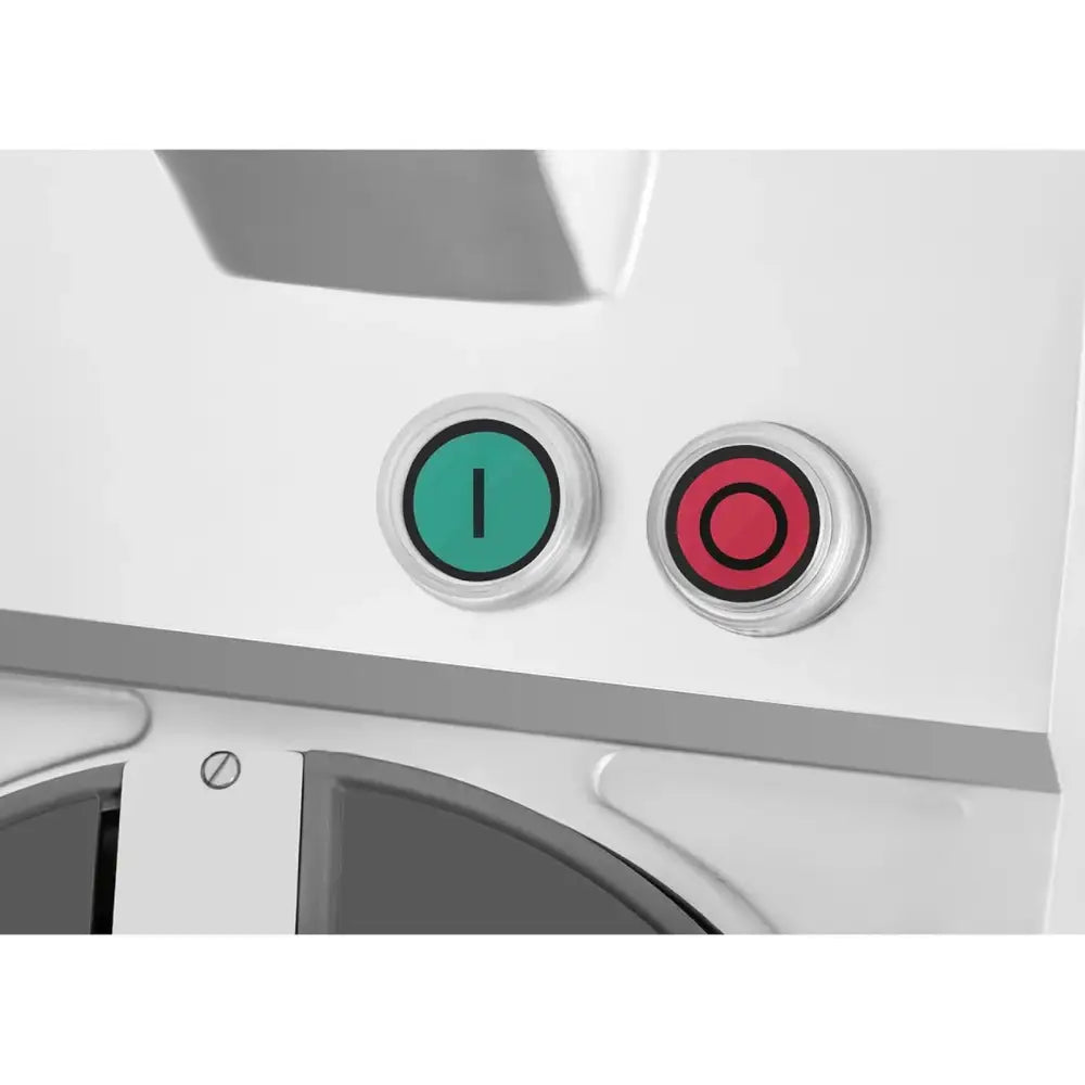 To store knapper på hvitt metallpanel, grønn for på og rød for av på elektrisk skiver og rive maskin.