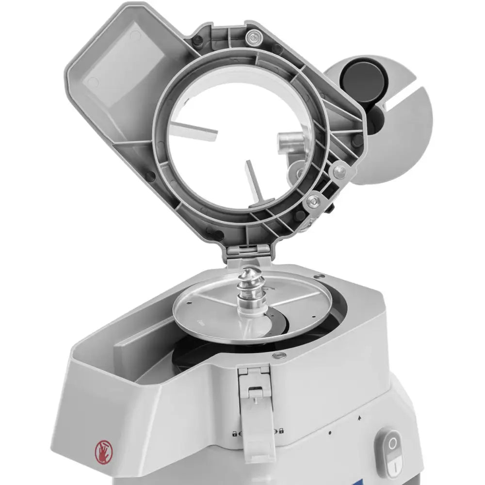 Elektrisk skjæremaskin, åpent grått lokk med synlige metallblader og mekaniske deler sett fra skrå vinkel.