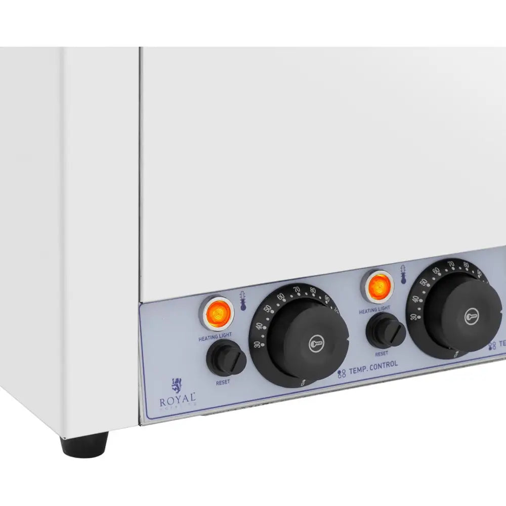 Elektrisk suppe fonduesmelter, kontrollpanel med tre dreieknapper, oransje lys og reset-knapper, sett skrått.