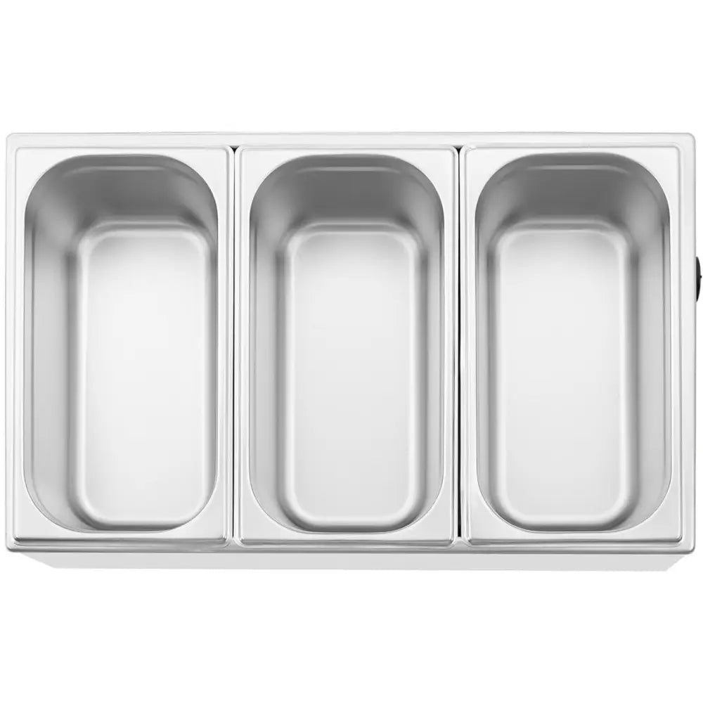 Elektrisk varmeovn med tre GN 1/3 beholdere i rustfritt stål, sett ovenfra med blank sølvfinish.