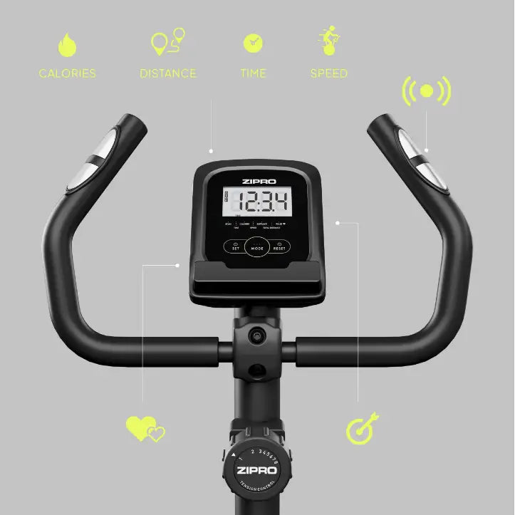 Ergometersykkel Zipro One, frontvisning som fremhever styre, digital skjerm og sølvfargede pulssensorer på håndtakene.
