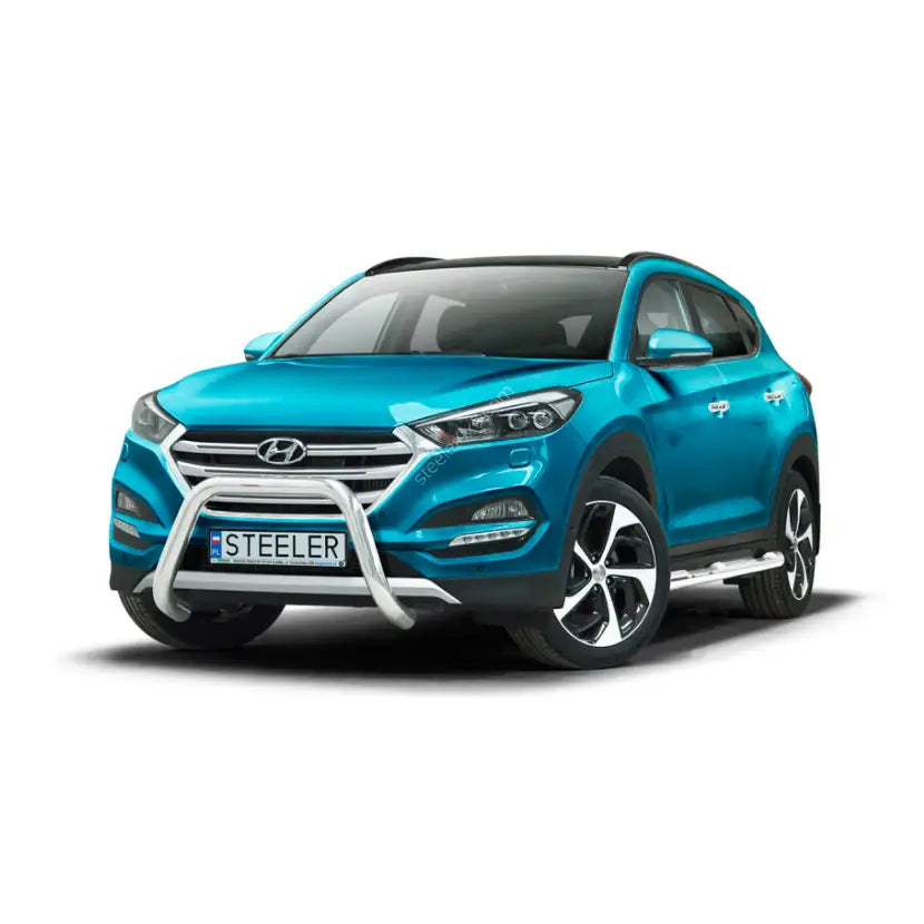 Frontbøyle Hyundai Tucson 15-18 i stål montert på turkis SUV med sorte detaljer og sølvfarget stigtrinn.