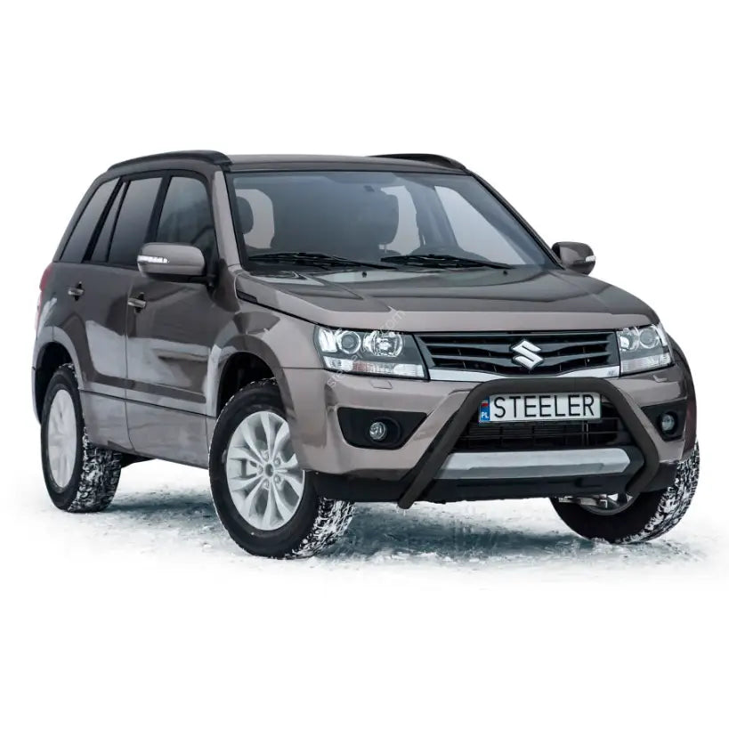 Kufanger på Suzuki Grand Vitara 06-14 med svarte ekstralykter, brun metallic lakk og snødekt underlag.