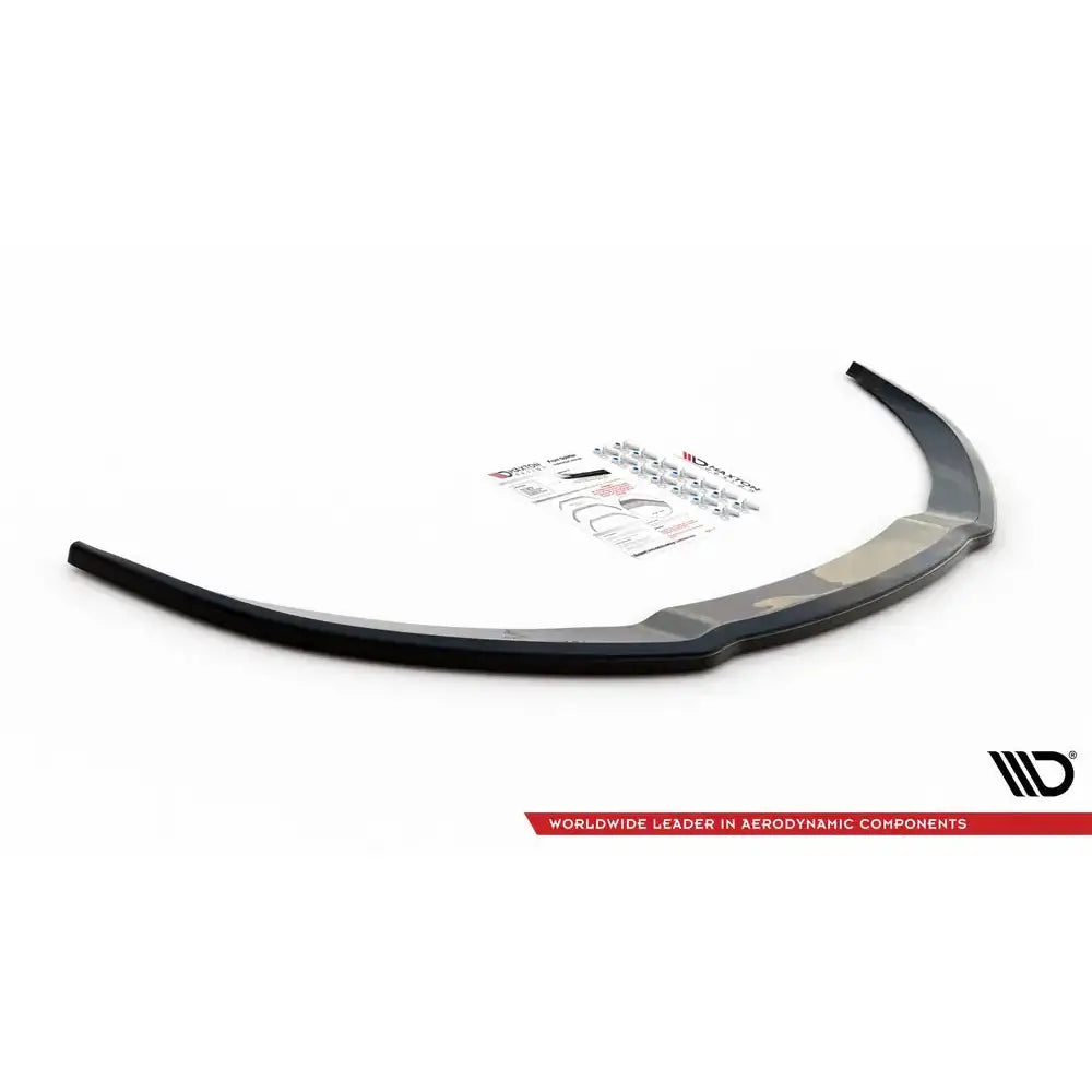 Front lip Audi S8 D3 svart plastspoiler med monteringsutstyr og instruksjoner i bakgrunnen.