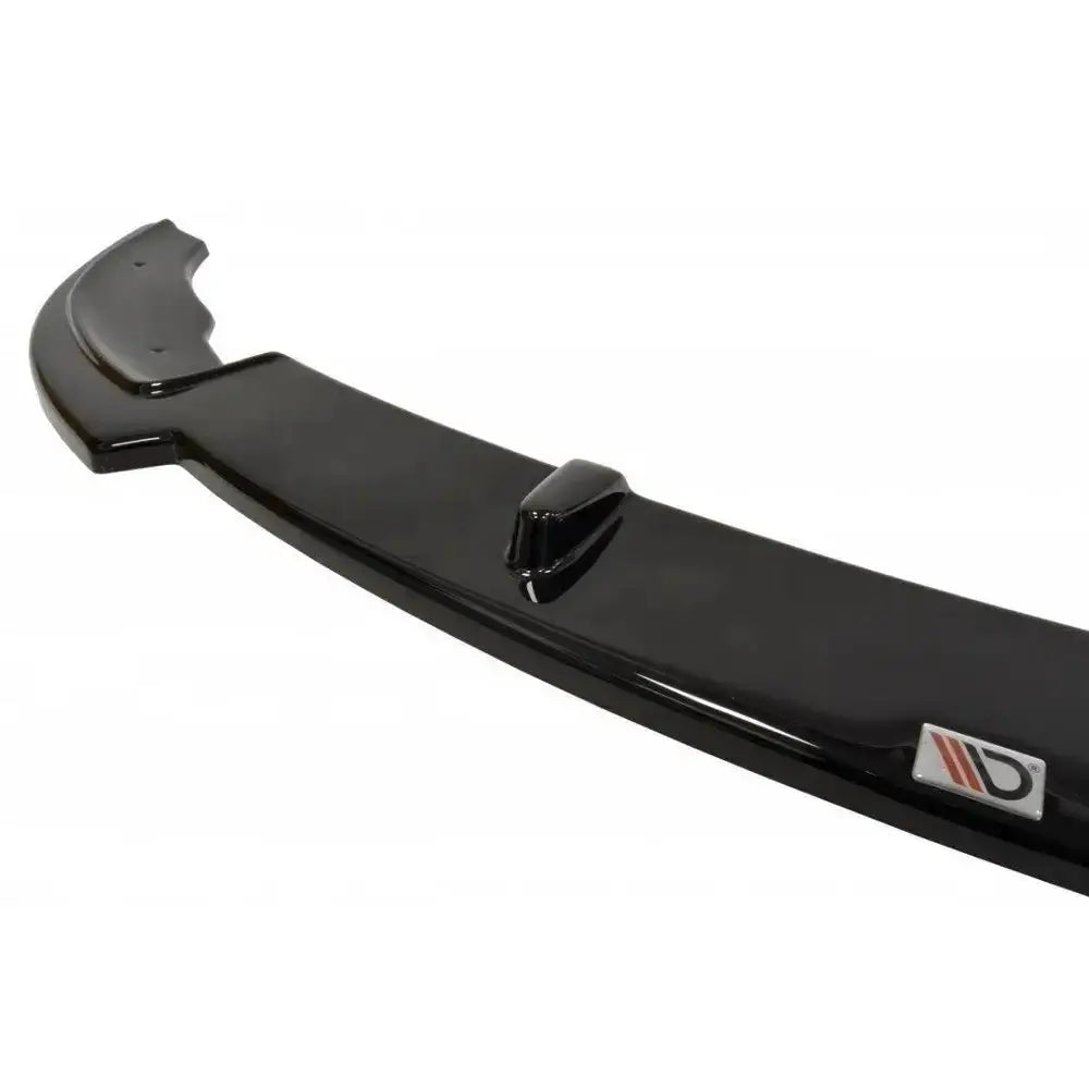 Frontspoiler BMW E46 3 Mpack Coupe i sort glans, sett skrått ovenfra med logo i rødt og grått.