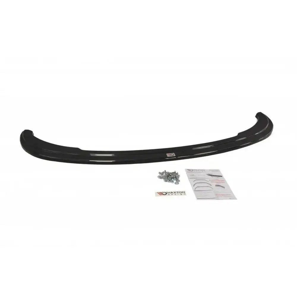 Frontspoiler BMW Z4 E85/E86 i svart blank plast med monteringsskruer og instruksjonsark foran.