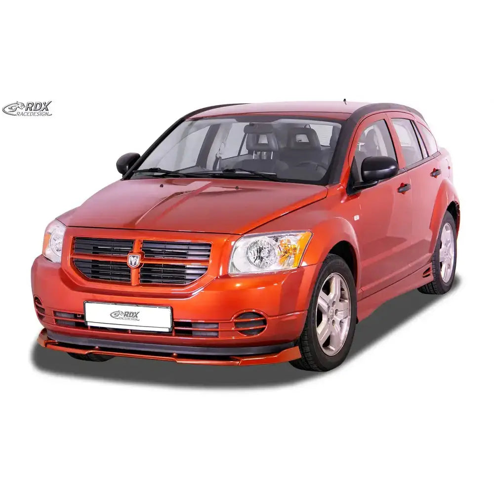 Frontleppe på Dodge Caliber 06-12 Vario X, oransje bil med sorte detaljer og spoiler foran, hvit bakgrunn.
