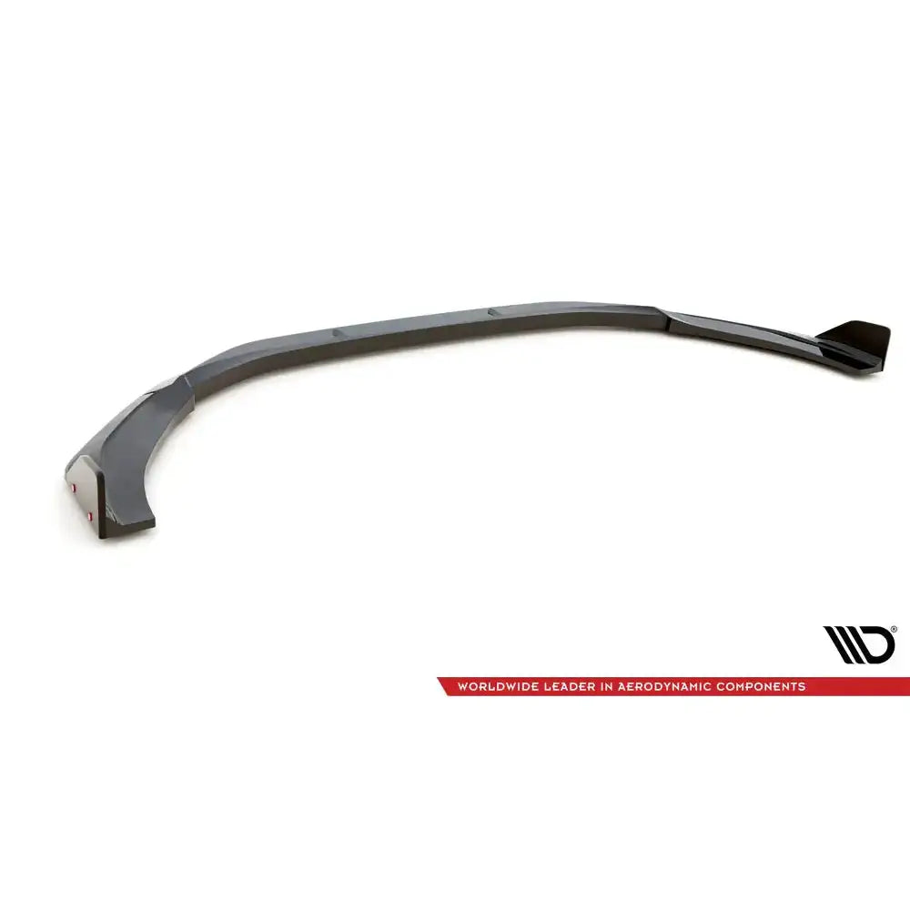 Frontspoiler Audi RS5 F5 Facelift V.1 med flaps, svart plast, skrå visning mot hvit bakgrunn.