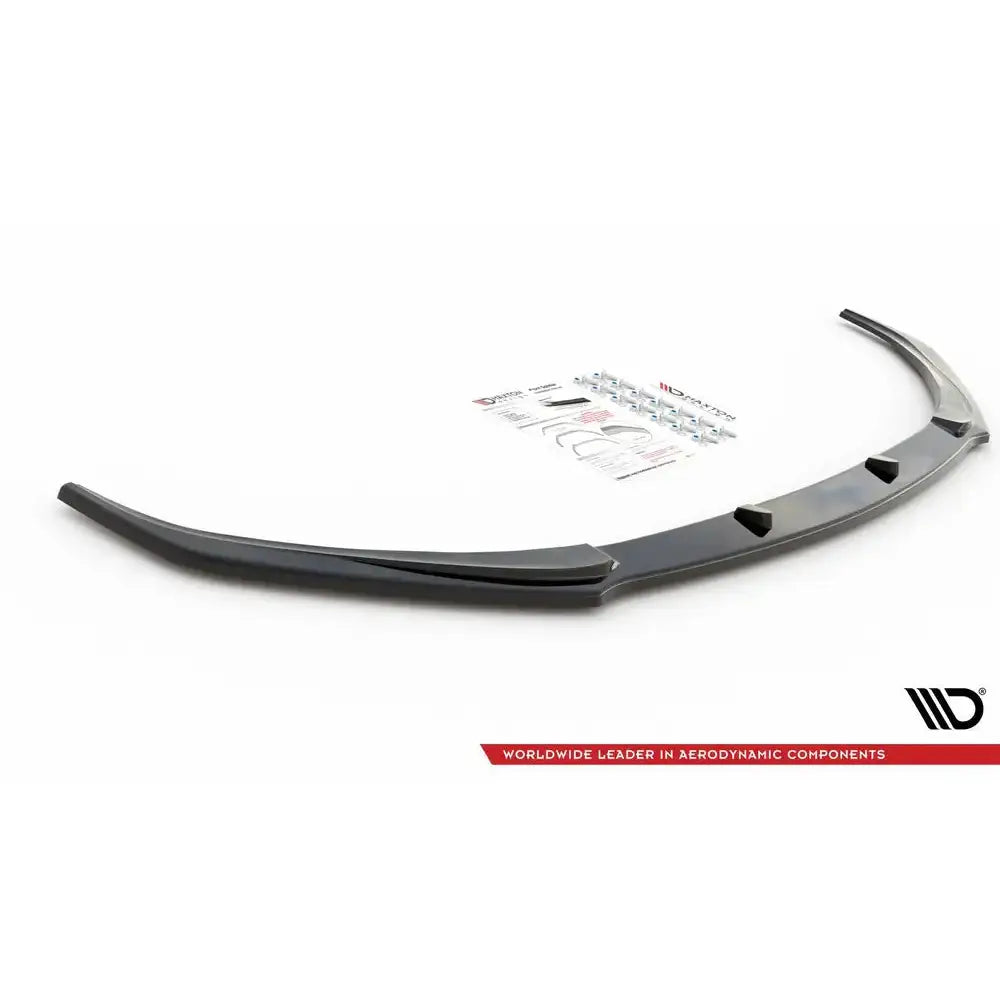 Front splitter Lexus LS MK4 Facelift, sort buet plast med monteringsutstyr og bruksanvisning i bakgrunnen.