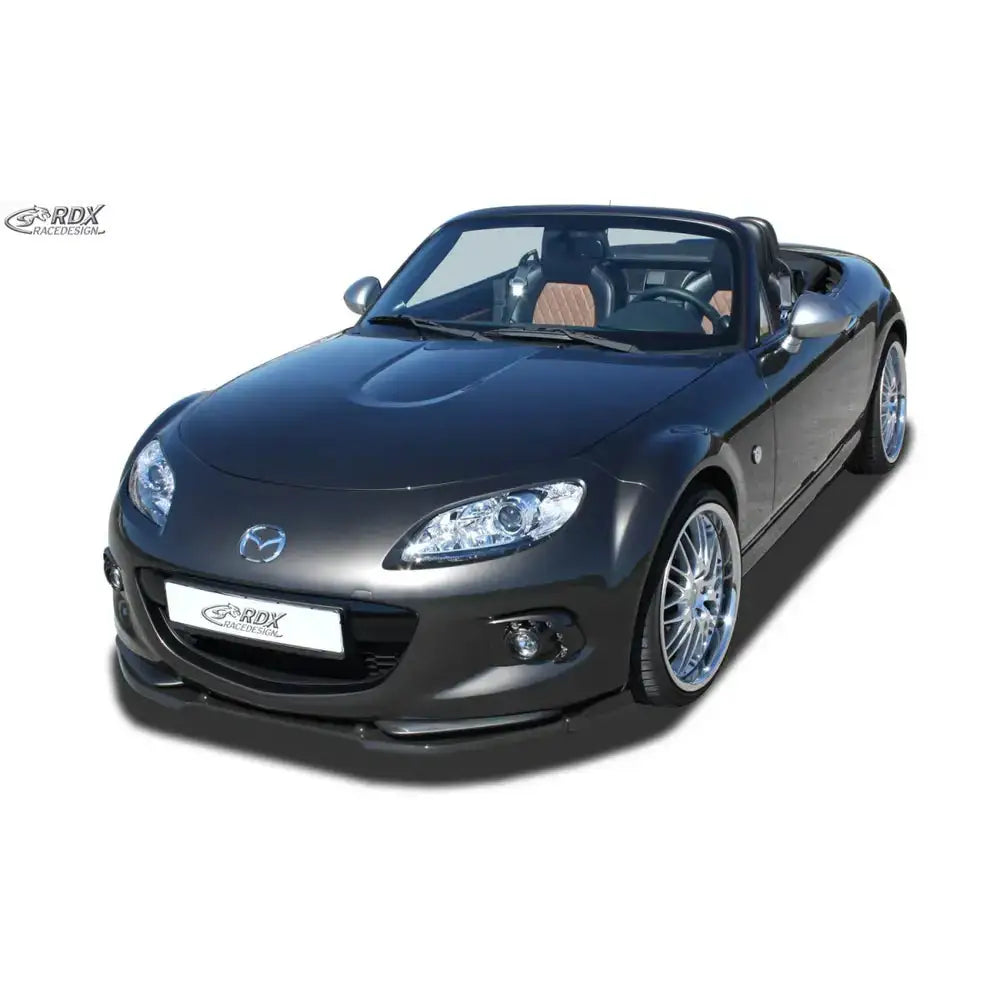 Frontleppe på Mazda MX5 NC 12-15 cabriolet sett skrått forfra med åpnet tak og sølvfelger.