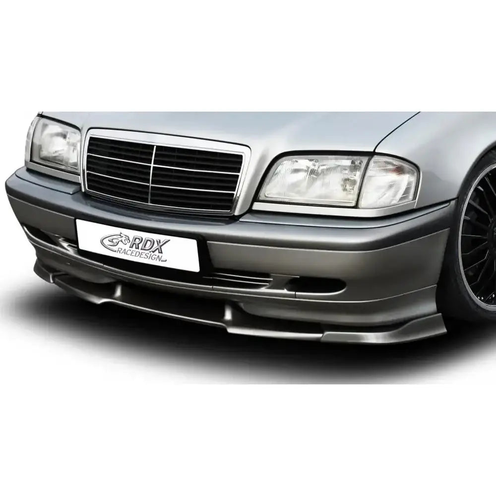 Frontspoiler Mercedes C-Klasse W202 Vario X, svart splitter under sølvgrå front med grill og lykter.