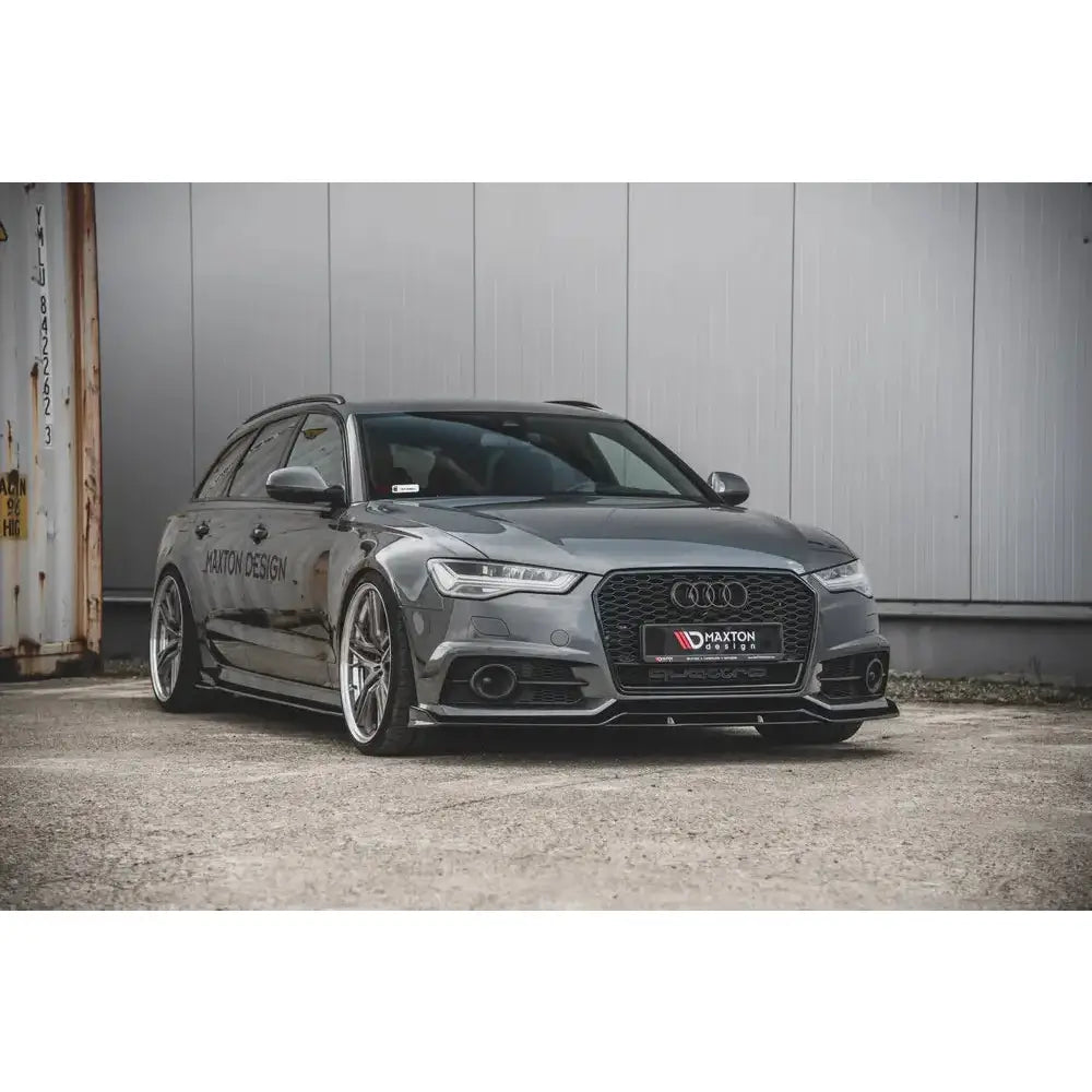 Front splitter på Audi S6 A6 S-Line C7 FL racing med sorte detaljer og sportsfelger foran industrivegg.