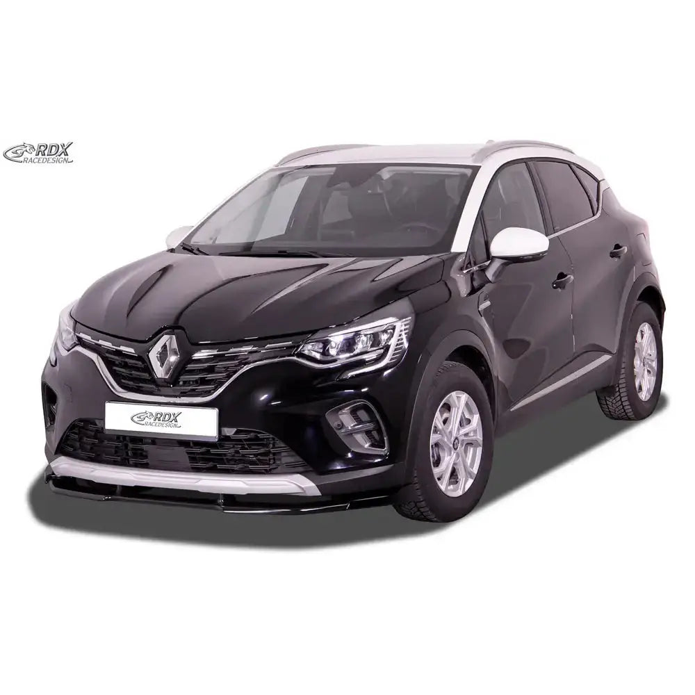 Frontleppe på sort Renault Captur II med sølv grill, hvitt tak og speil, LED-frontlykter, hvit bakgrunn.