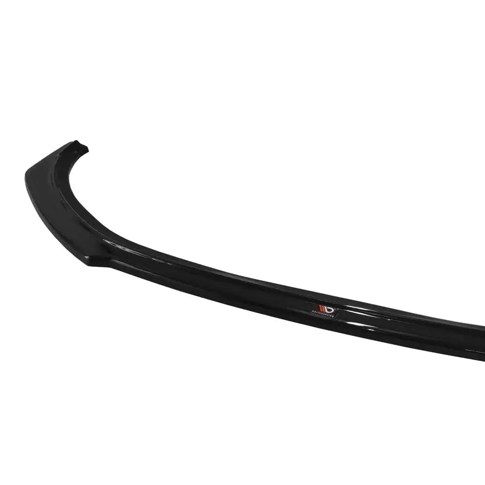 Front lip til Renault Clio Mk4 Rs, sort blank spoiler med logo, avbildet fra skrå vinkel mot hvit bakgrunn.