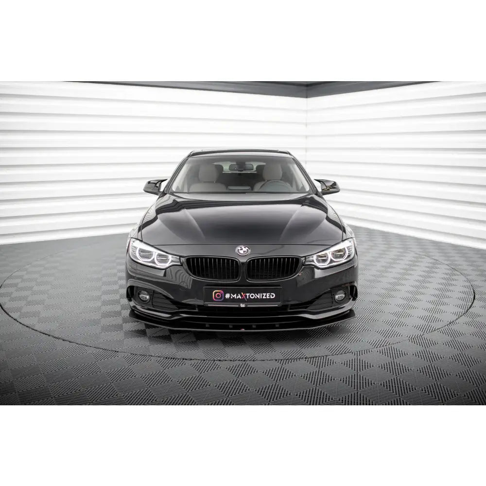 Spoiler på BMW 4 Gran Coupe F36 Street Pro, sort front med skarpe lys og blank grill, sett forfra.