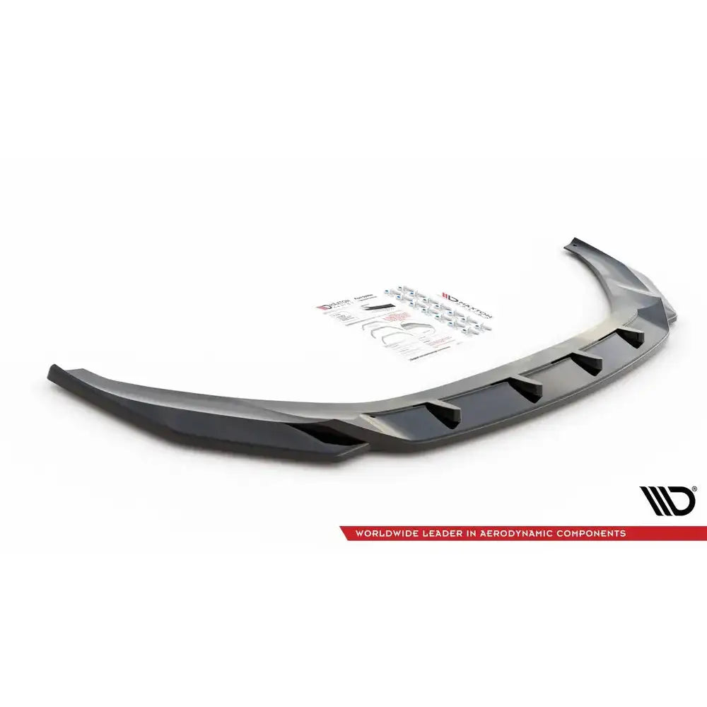 Front splitter Audi A7 C8 V.1 svart plast med markerte vinkler, monteringsutstyr i bakgrunnen.