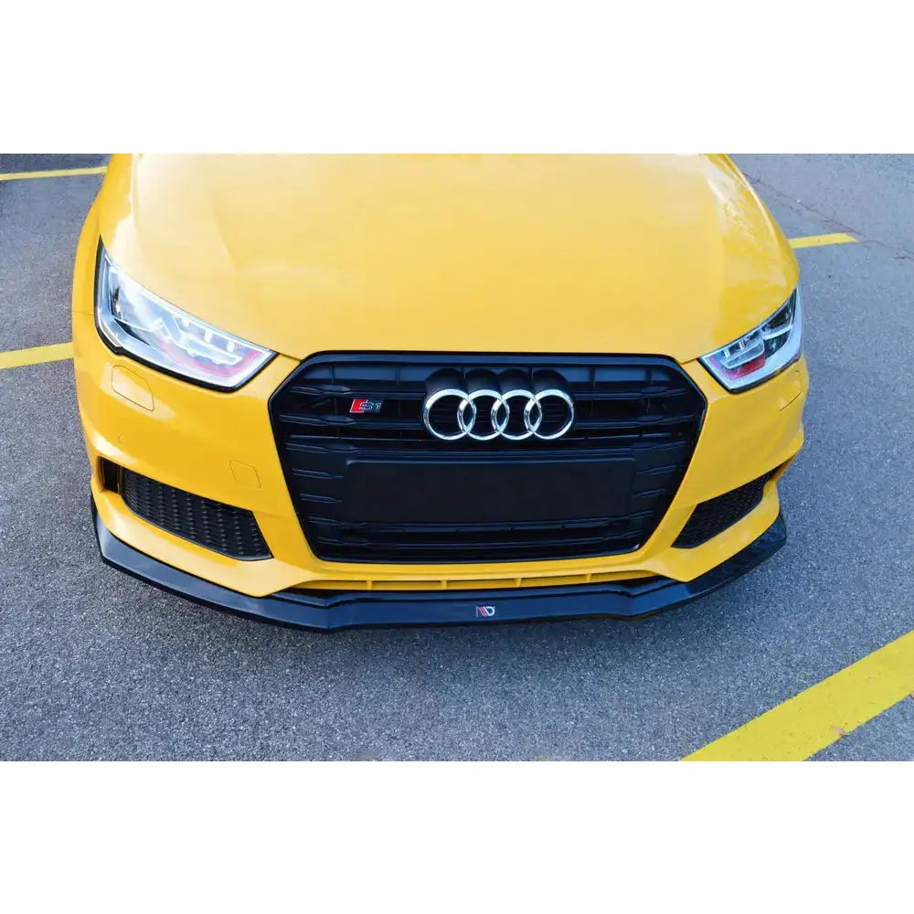 Frontleppe på Audi S1 Mk1 V.1, gul bil sett forfra med sort leppe under støtfangeren.