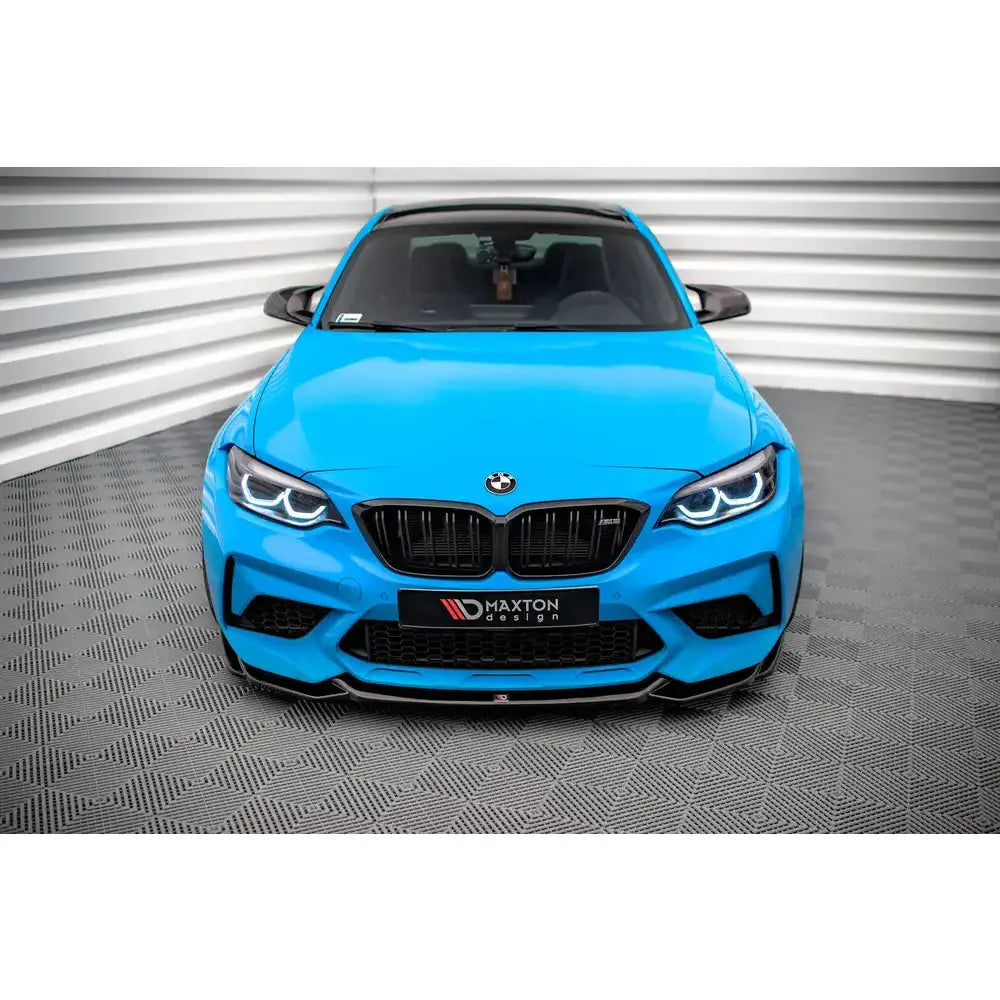 Frontleppe på BMW M2 Competition F87 V.1, blå bil sett forfra med svarte detaljer og LED-lys.