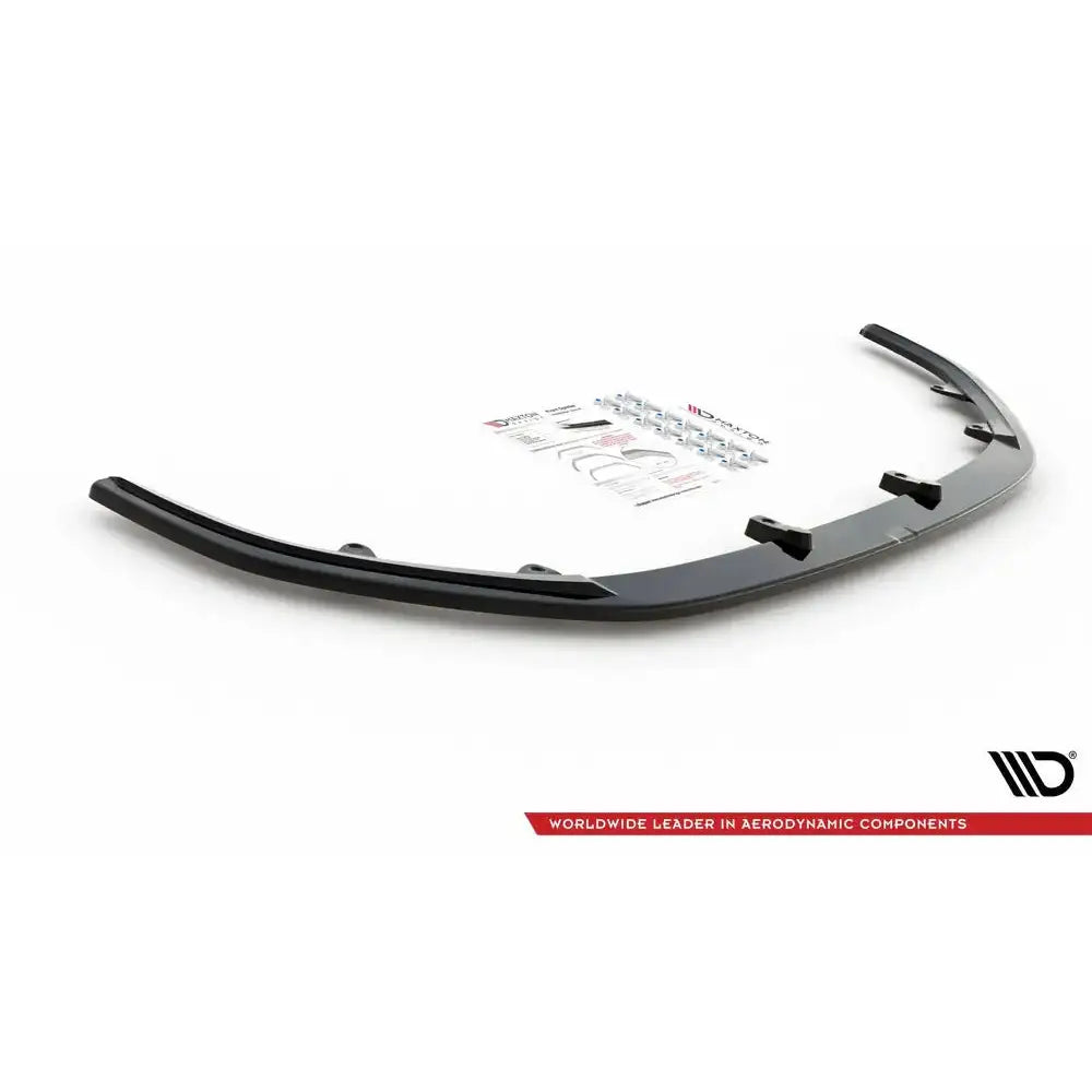 Front splitter for Mazda CX-3 V.1 15-, sort plast med monteringsutstyr og instruksjoner på hvit bakgrunn.