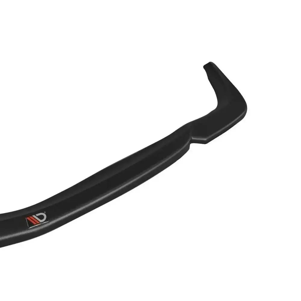 Frontleppe til Mercedes CLS C219 V.1 55AMG i sort plast med logo, nærbilde på hvit bakgrunn.