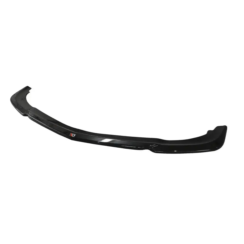 Front lip til Mercedes E63 AMG W212 V.1 i sort plast med synlig logo, sett skrått ovenfra.