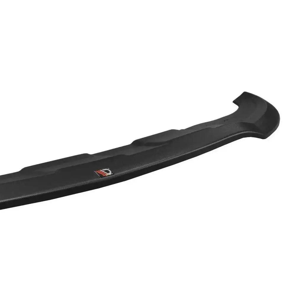 Frontspoiler Mercedes Gle W166 V.1 Amg-Line i sort plast med logo og strukturert overflate, sett fra skrå vinkel.