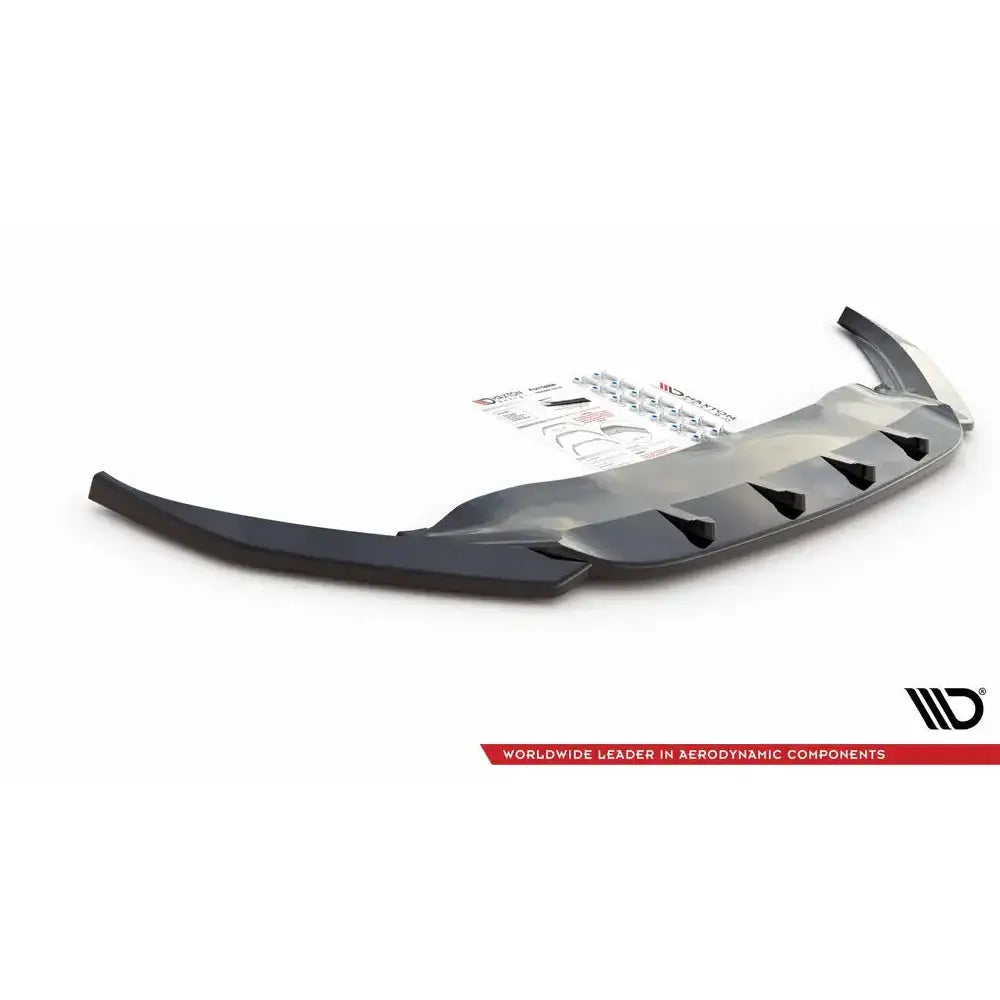 Front lip Volkswagen Passat B8 V.1 sort plast med finner, sett skrått ovenfra, monteringsutstyr i bakgrunnen.