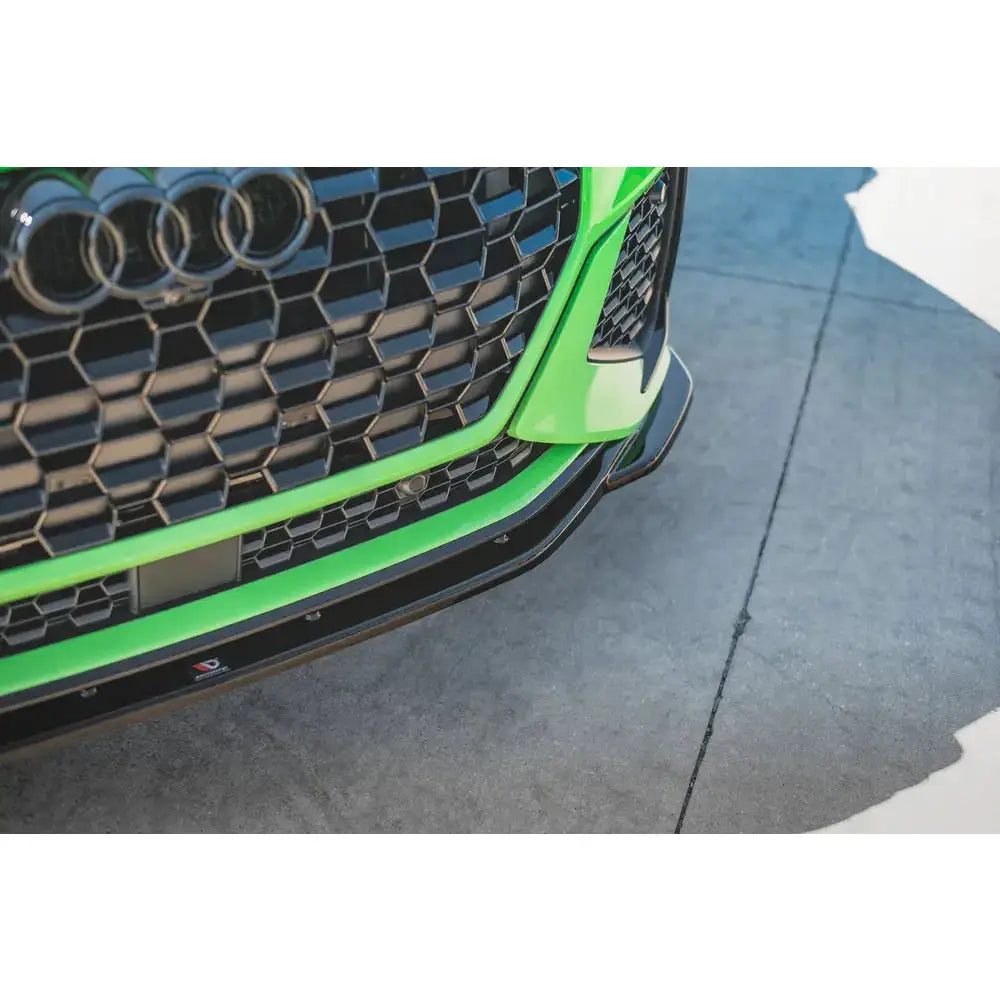 Frontspoiler Audi RSQ3 F3 V.2 nærbilde med grønn lakk, svart grill og blank sort splitter.