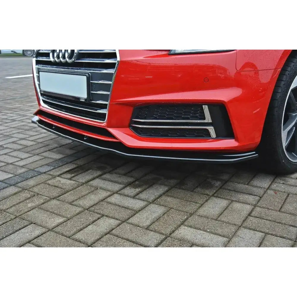 Front splitter på Audi S4/A4 S-Line B9 V.2, sort plast, montert på rød bil, skrå vinkel, brostein.