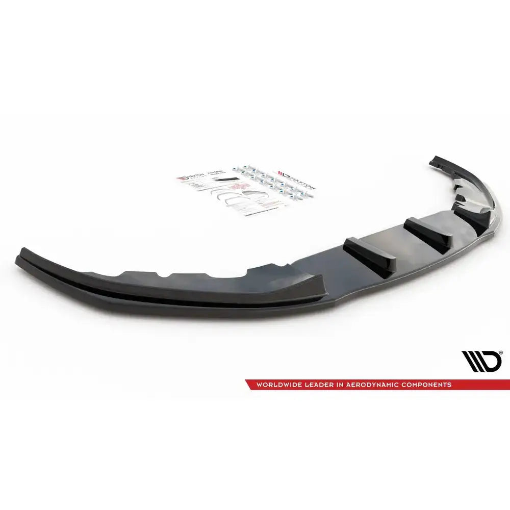 Front lip til BMW 7 G11 M-Pack V.2, svart plast med ribber, monteringsutstyr synlig bak.