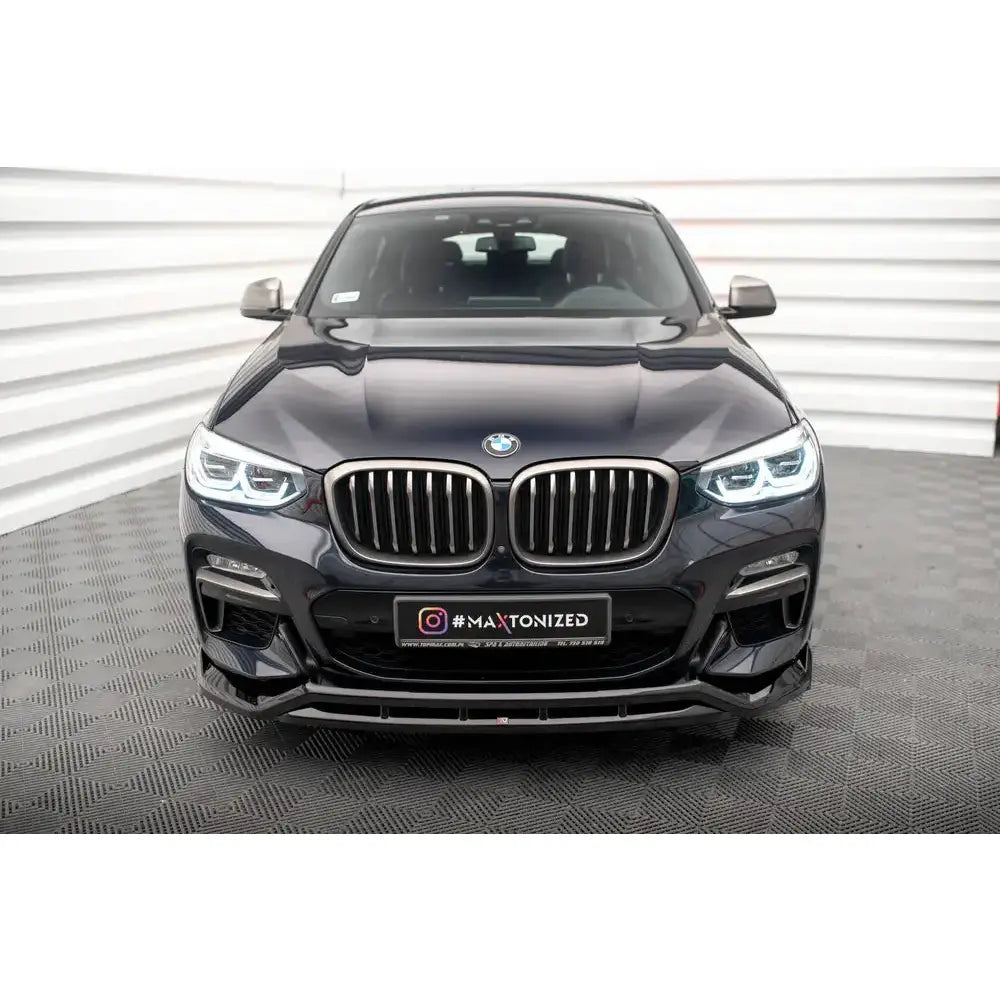 Frontleppe til BMW X4 M-Pack G02 Facelift 21- i sort med markante LED-lykter og krommet grill.