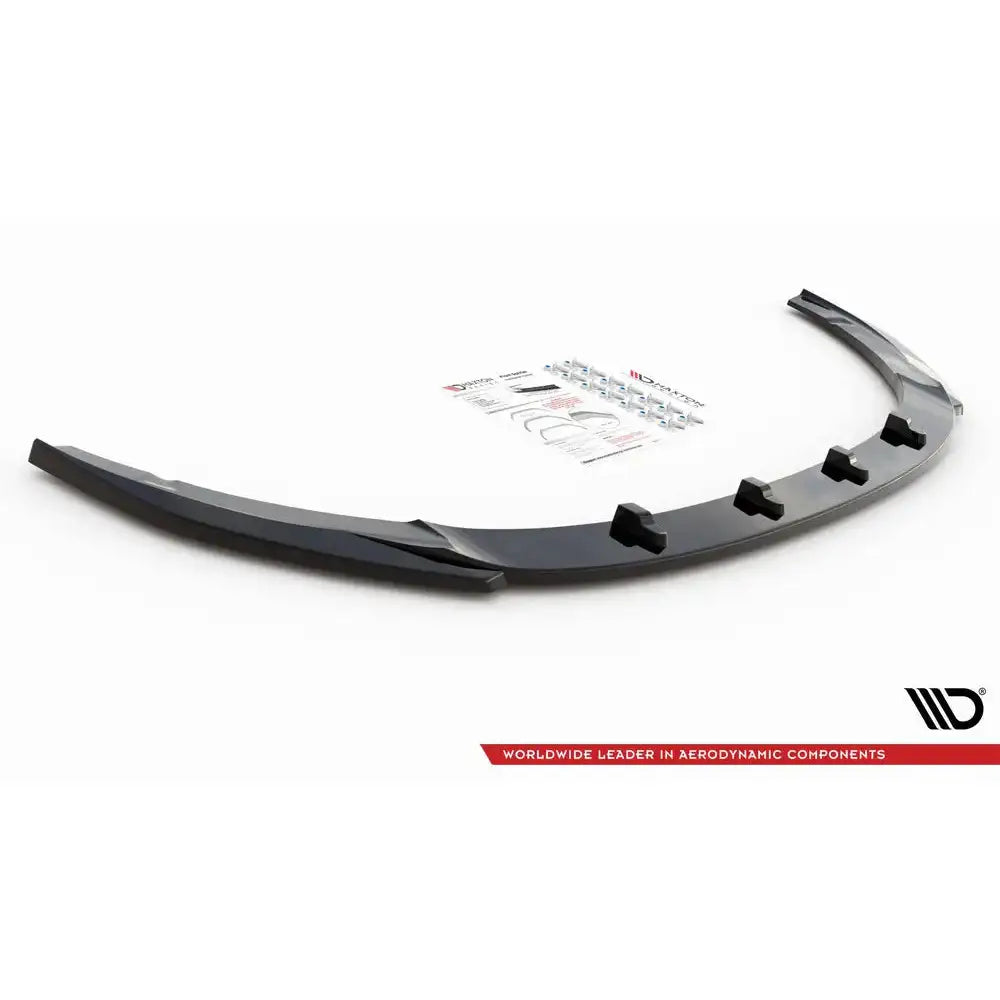 Front lip til Kia Optima Mk4 V.2, svart plast med festeputer, monteringsutstyr i bakgrunnen.