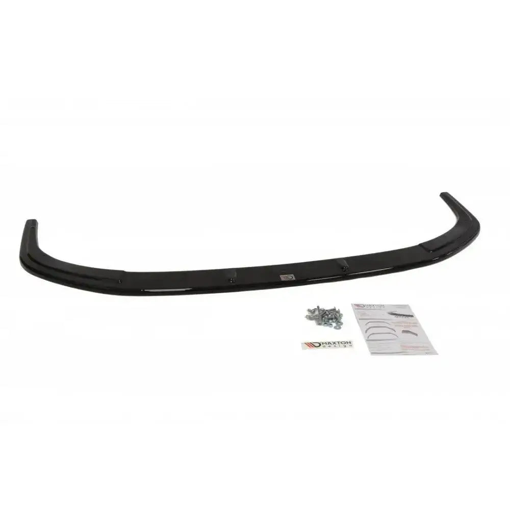 Spoiler til Mitsubishi Lancer Evo X V.2 sett ovenfra med monteringsskruer og instruksjonsark.