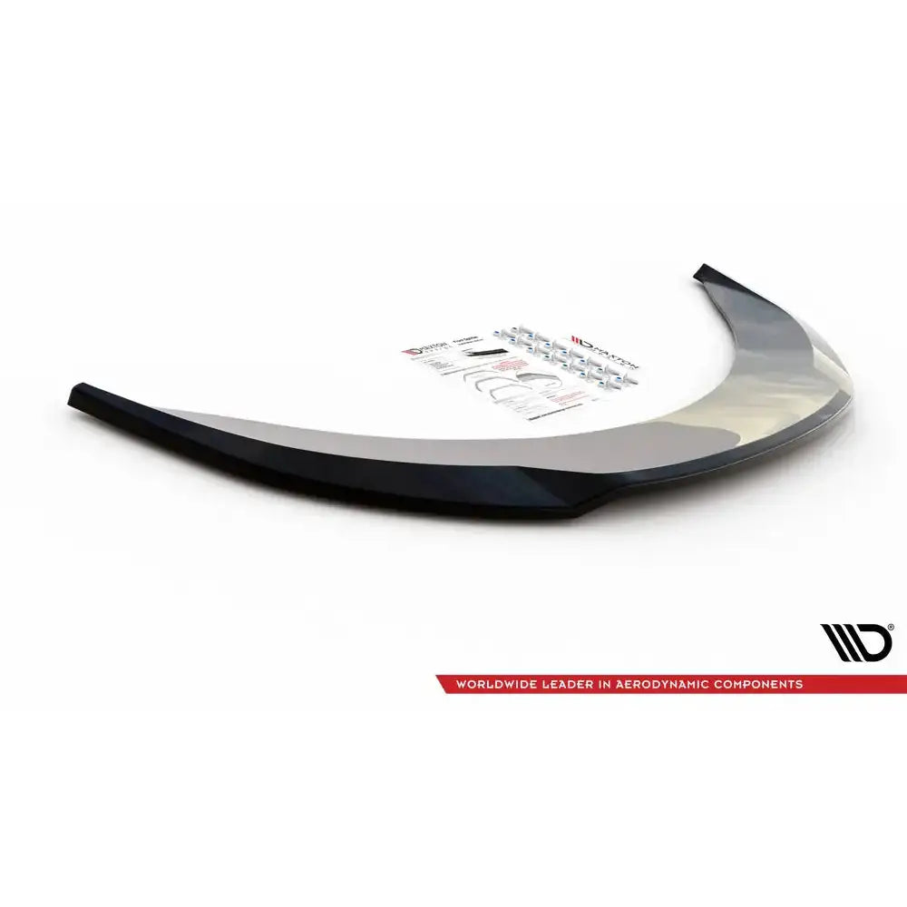 Front lip til Seat Exeo 08-13 V.2, sort buet plastdel med monteringsutstyr og instruksjoner i bakgrunnen.