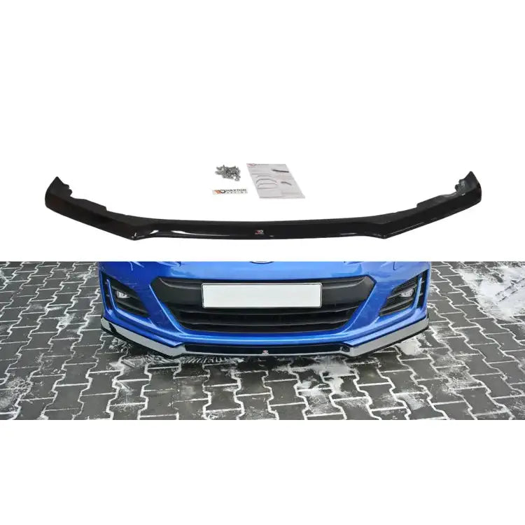 Frontspoiler Subaru Brz Facelift V.2 sort plast med blank finish, vist montert på blå bil med monteringsutstyr.