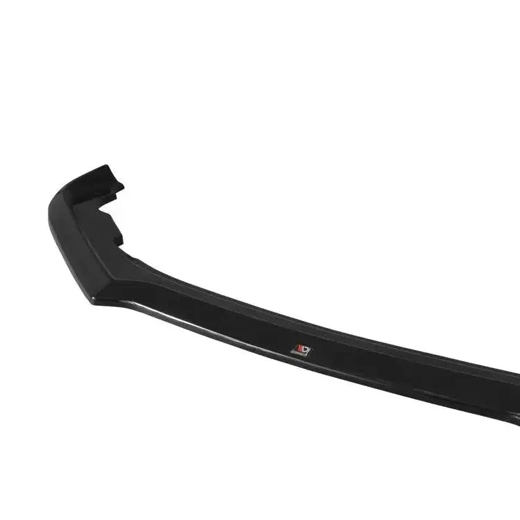 Front lip Subaru Brz Facelift V.2 i sort, glanset plast med liten logo, sett ovenfra mot hvit bakgrunn.