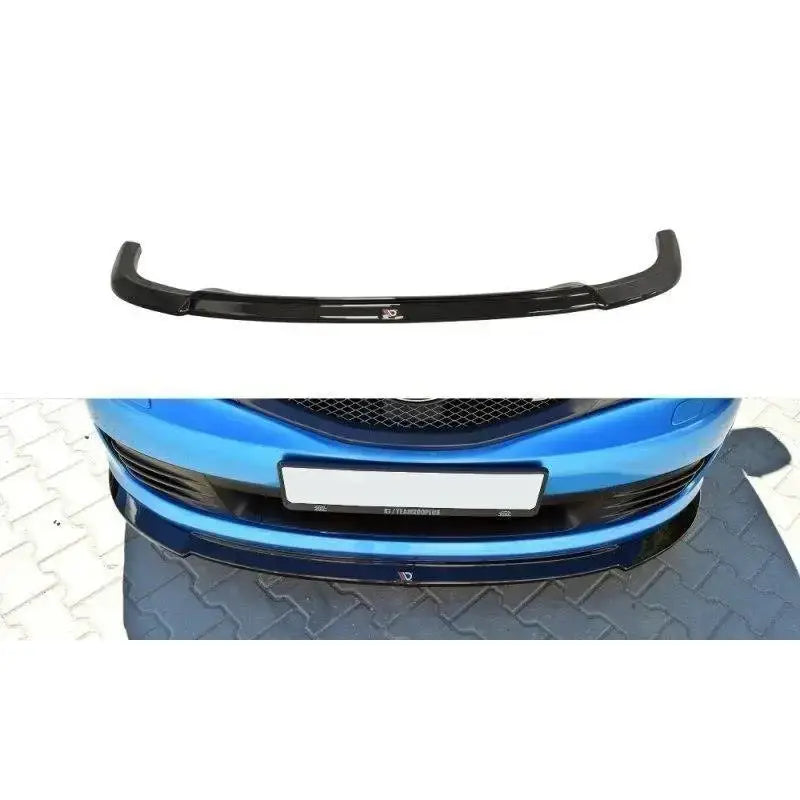 Frontspoiler Subaru Impreza Wrx Sti V.2 2009-2011 sett ovenfra og montert på blå bil forfra.