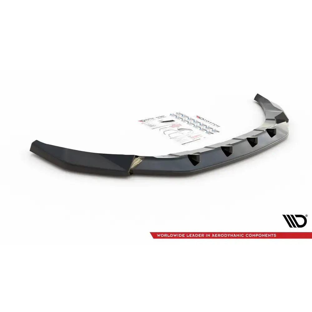 Front splitter til Volkswagen T-Roc Mk1 V.2, sort plast med monteringsfester og instruksjonspapirer.