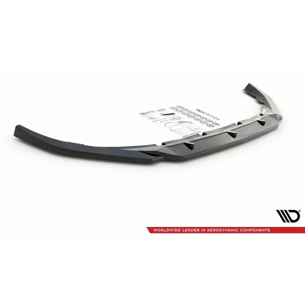 Frontspoiler Volvo S60 R-Design Mk3 V.2 med monteringsutstyr og instruksjoner mot hvit bakgrunn.