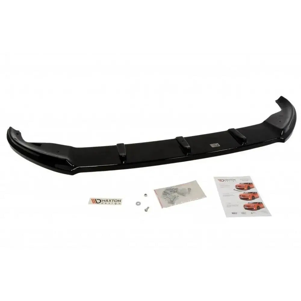 Frontleppe VW Golf VII V.2 sort glanset spoiler med monteringsutstyr og instruksjonsark på hvit bakgrunn.