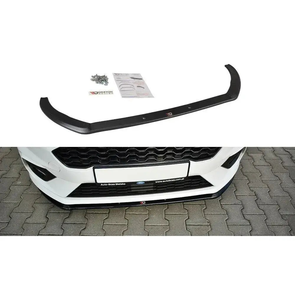 Frontspoiler til Ford Fiesta Mk8 ST st-Line V.3 vist ovenfra med skruer, instruksjon og montert på hvit bil.