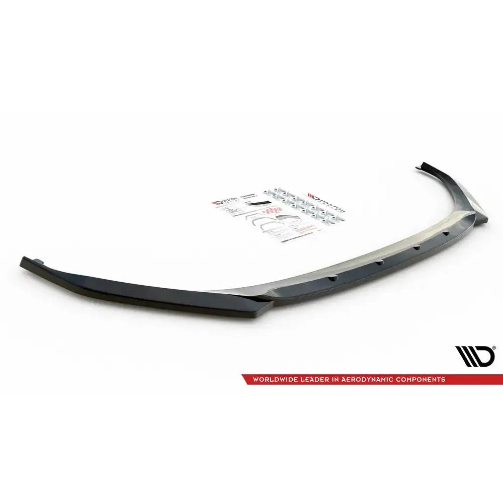 Front lip til Skoda Enyaq iV V.3, sort plastspoiler med festebraketter og monteringsanvisning ovenfra.