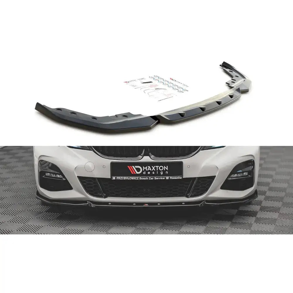 Frontspoiler BMW 3 G20/G21 M-Pack V.5 sort plast med tilbehør, montert på hvit bil forfra.